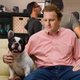 Illustration for article titled Least Popular Guy At House Party Really Hitting It Off With Dog